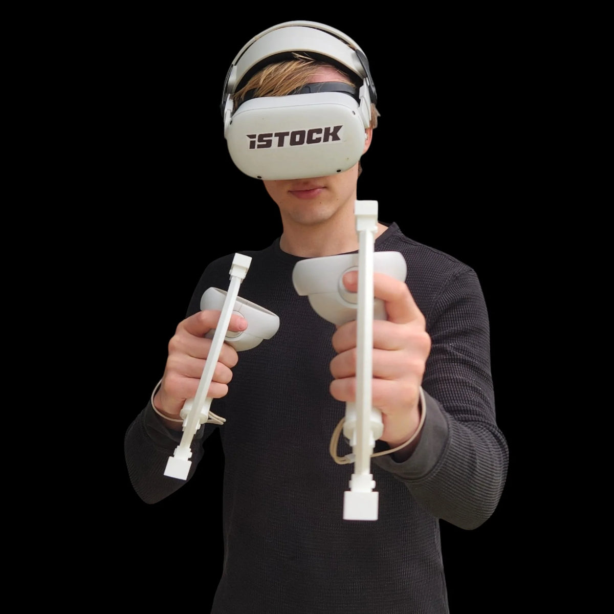 Man holding the ARC Sword attachment together at chest height, connected